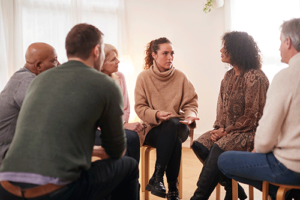participants in a group therapy program meet for a session